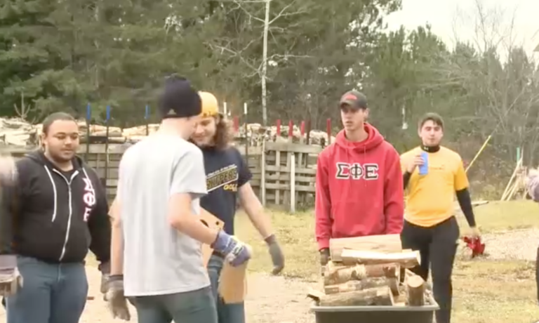Sigma Phi Epsilon Fraternity helps chop wood for Little Brothers-Friends of the Elderly