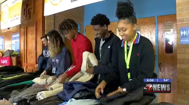 Local fraternity gathers coats for Eisenhower High’s clothing closet
