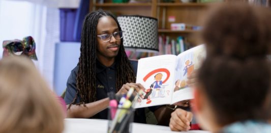 Fraternity provides positive male role models through reading