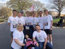 Brothers push wheelchair-enabled athlete in race