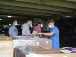 Pi Kappa Phi unboxes hand sanitizer philanthropy