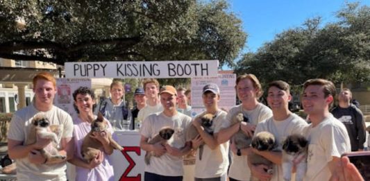 Sigma Nu ‘puppy kissing booth’ raises money for animal rescue