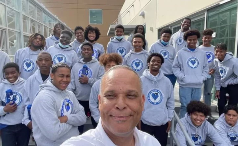 Community pays tribute to leader whose group mentored, steered young men to college
