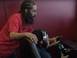 Instructor teaches young student using a flight simulator.