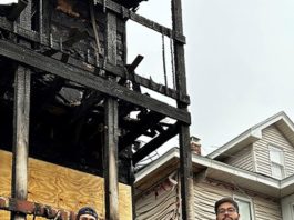 Sigma Phi Omicron brothers Rohan Solanki, right, and Arseniy Ohorilko in front of the duplex where they rescued several people from a fire.