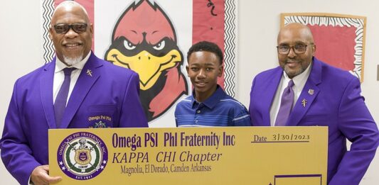 Omega Psi Phi fraternity member Silberty Hyndman; first-place talent show winner Zachery Morehead; and Talent Hunt chair Terry Calahan.