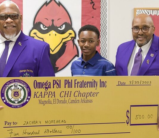 Omega Psi Phi fraternity member Silberty Hyndman; first-place talent show winner Zachery Morehead; and Talent Hunt chair Terry Calahan.