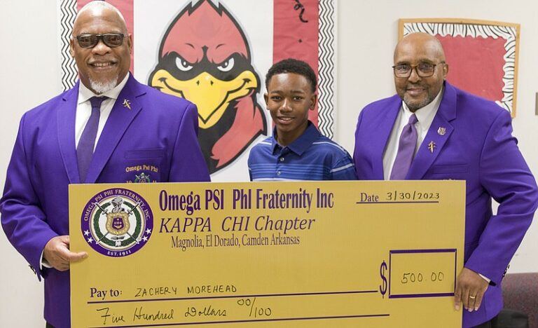 Omega Psi Phi fraternity member Silberty Hyndman; first-place talent show winner Zachery Morehead; and Talent Hunt chair Terry Calahan.