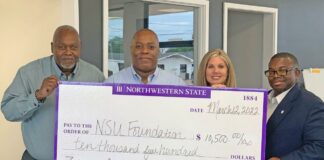 Alumni brothers of Phi Beta Sigma Fraternity, Inc. present a check of $10,500 to the NSU Foundation.