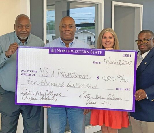Alumni brothers of Phi Beta Sigma Fraternity, Inc. present a check of $10,500 to the NSU Foundation.