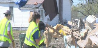 Sigma Alpha Epsilon fraternity members clean up after tornado ravaged Sullivan, Ind.