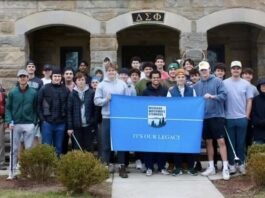 The Michigan Waterway Stewards and Delta Sigma Phi fraternity after their day cleaning up the Red Cedar River.