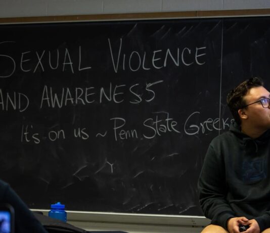 Greeks Care president Jacob Frank speaks to the group of students during the Greeks Care presentation.