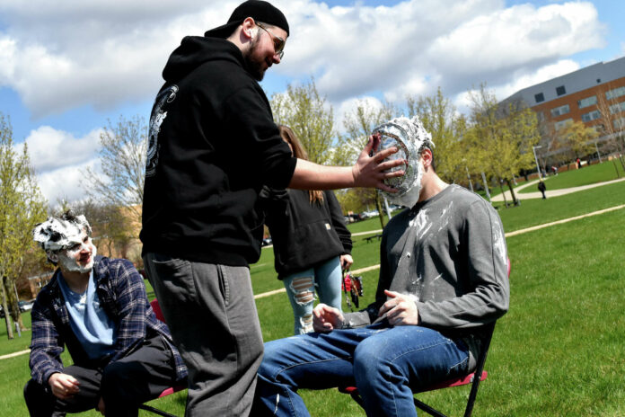 Lambda Chi Alpha members Sam Belanger (right) and Curt Sutherland (left) were among the fraternity brothers to get pied as part of a fundraiser raising money for their fraternity. Trevor Teeple (standing) was among the pie throwers Tuesday. The Lambda Chi Alpha fundraiser ran from 11 a.m. to 4 p.m. and will run again from 11 p.m. to 4 p.m. Wednesday at Ferris State University's Robinson Quad. 1 of 3 Lambda Chi Alpha members Sam Belanger (right) and Curt Sutherland (left) were among the fraternity brothers to get pied as part of a fundraiser raising money for their fraternity. Trevor Teeple (standing) was among the pie throwers Tuesday. Photo by Brendan Sanders/Big Rapids Pioneer.