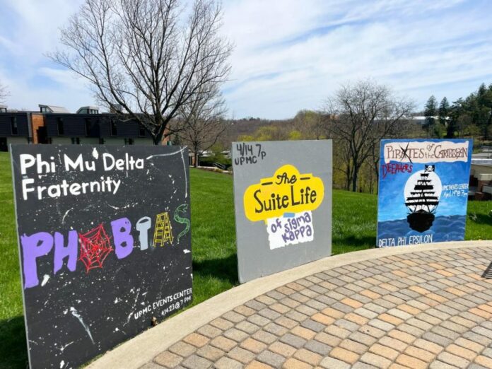 Sororities and fraternities painted signs of their upcoming Airband themes.