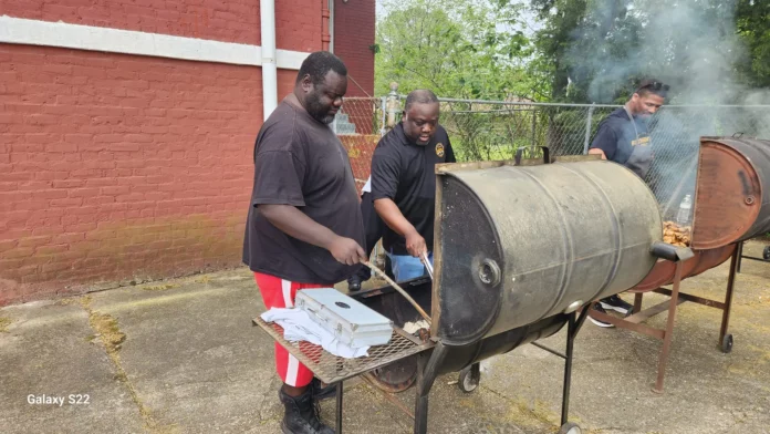 Alphas grilling at community recovery day.