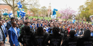 Spring ‘23 initiates of Phi Beta Sigma Fraternity Inc. chant in front of a crowd in The Yard on April 7. (Keith Golden Jr/The Hilltop)