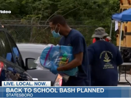 Statesboro’s annual Back to School Bash happening Saturday Omega Psi Phi International Fraternity members hand out back packs for back to school.