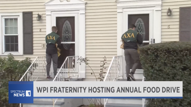 For 29th year, WPI’s Lamda Chi Alpha hands out bags to city residents for annual food drive