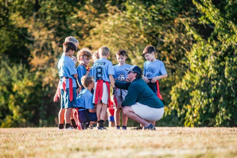 Alpha Gamma Rho members coach local flag football team
