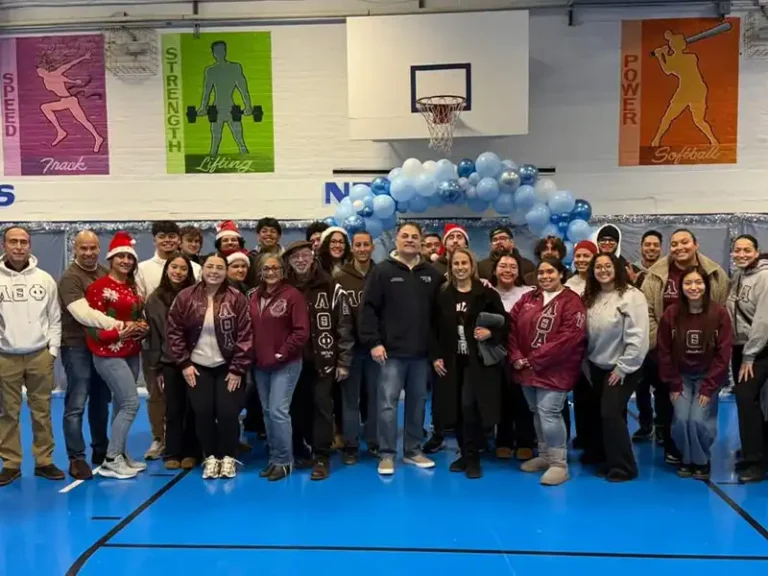 Paterson officers and Lambda fraternity spread holiday cheer at annual Christmas event